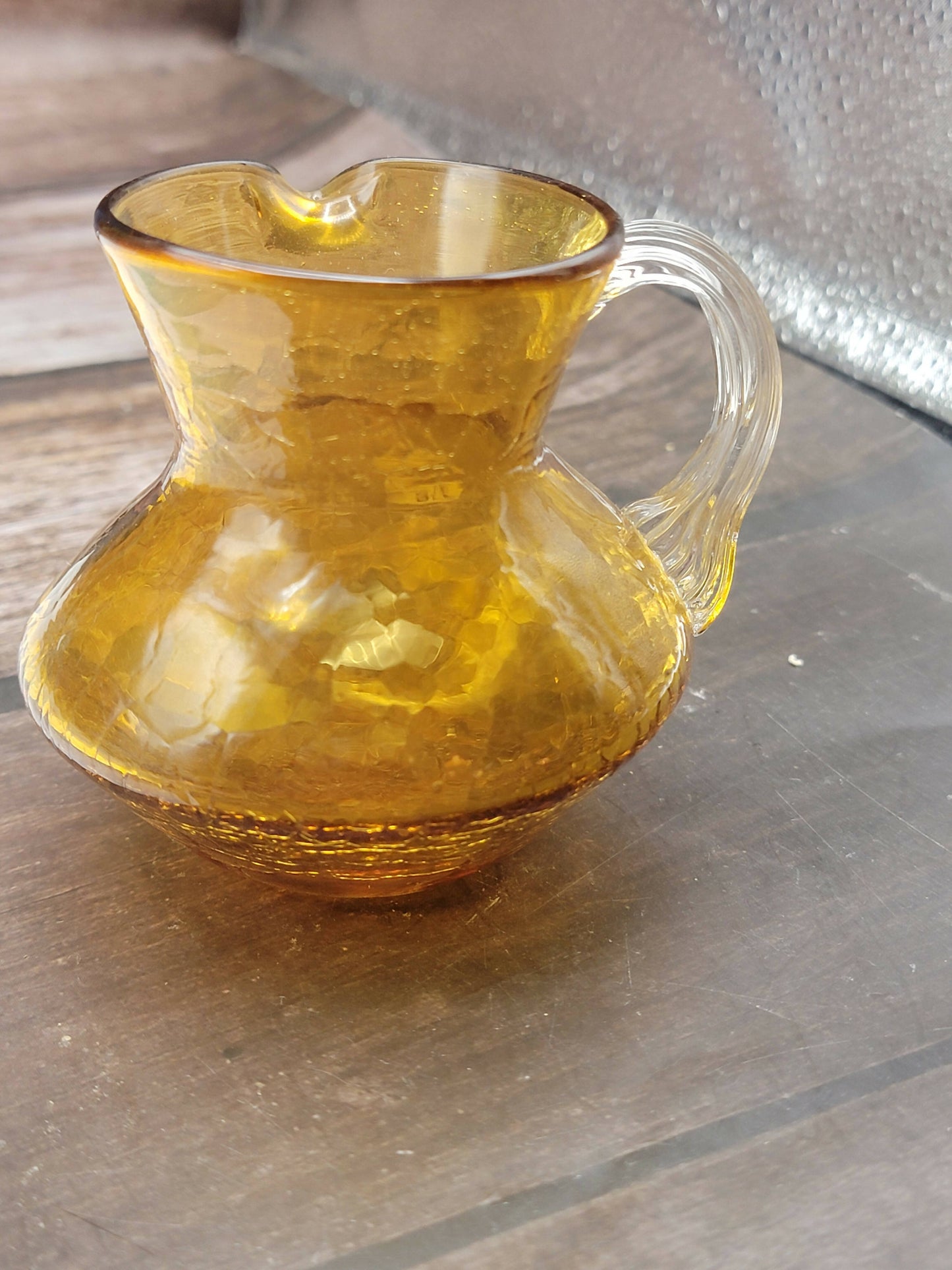 Small amber crackle glass pitcher