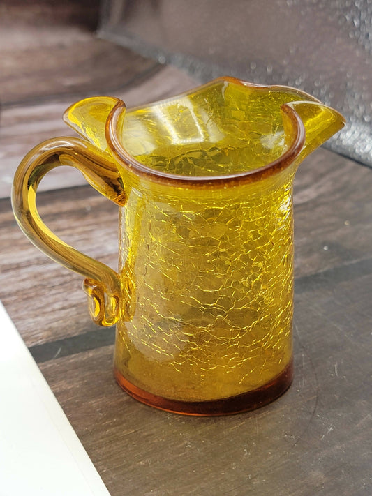 Small orange crackle glass ruffle pitcher