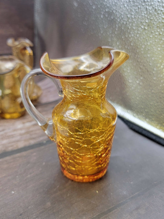 Small orange crackle glass pitcher