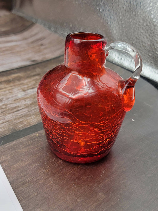 Small red crackle glass jug