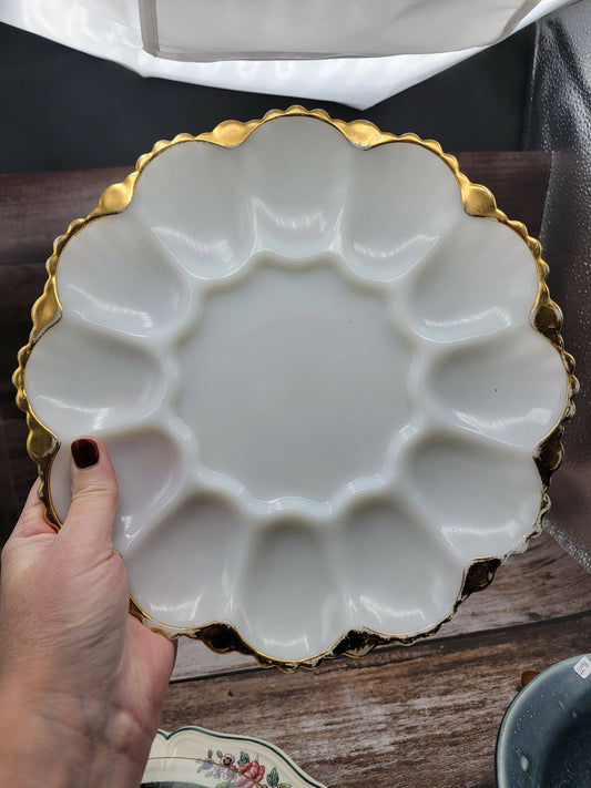 Milk glass egg plate with gold rim